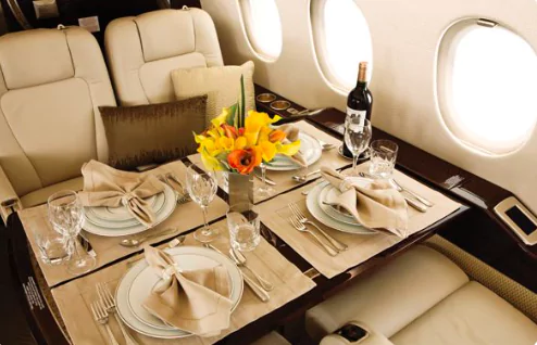 Having dinner in a private jet